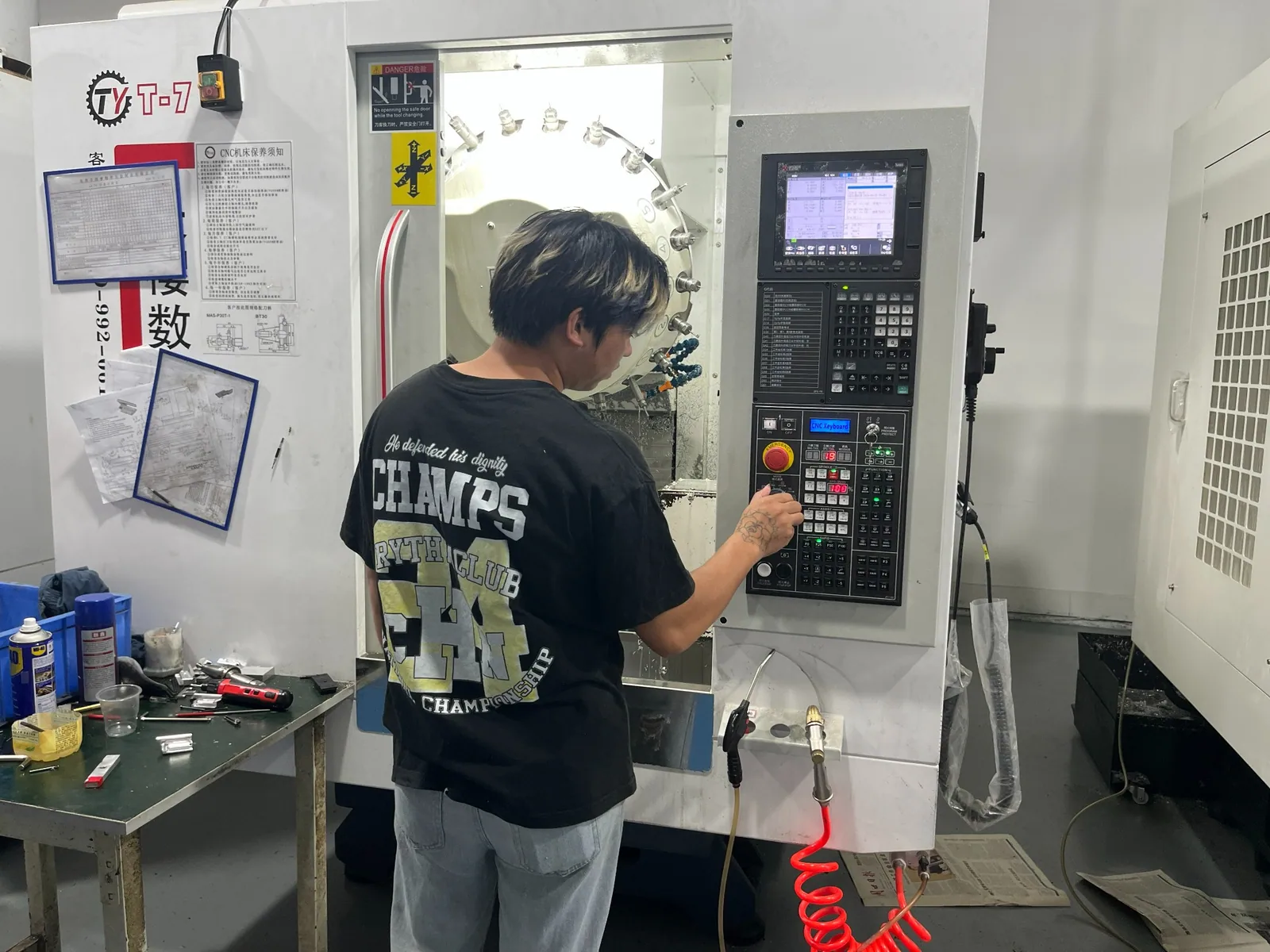 Operator working at a machine control panel